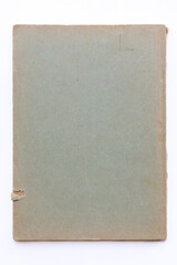 Destroyed cardboard cover of a very old book. yellowed natural paper texture. isolated on white background. clean close-up.