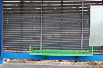 A bench for relaxing in a city park on the seashore.