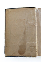 inner page of a very old book. yellowed natural paper texture. on isolated white background. clean close-up.