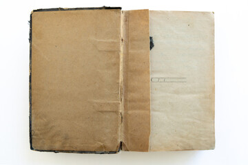 inner page of a very old book. yellowed natural paper texture. on isolated white background. clean close-up.
