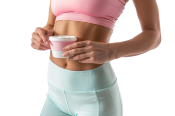 A woman wearing pink and blue sporty attire holds a cup of yogurt, highlighting fitness and healthy living. The white background emphasizes the subject.