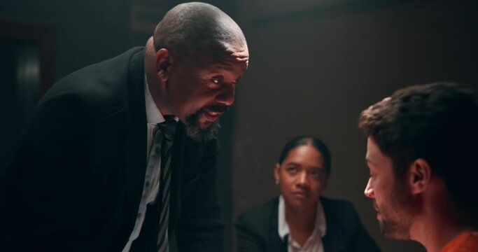 Interrogation, threat and police with prisoner in jail for statement of fraud, crime or scam. Questions, investigation and team of private detectives talking to man thief for legal justice system.