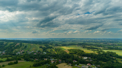Fototapeta premium Aerial view rural landscape farms villages picturesque green