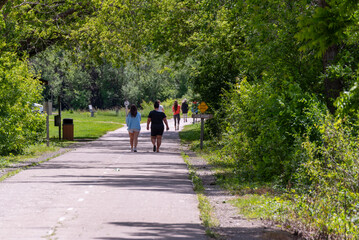 People walking on the Fox River Trail near De Pere, Wisconsin, in summer