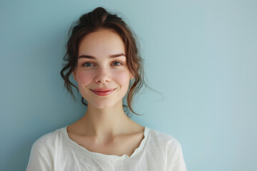 Fototapeta premium A close up portrait of a young woman with a subtle smile