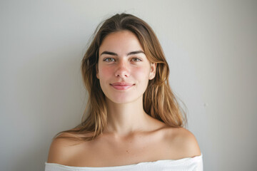Fototapeta premium A close up portrait of a young woman with a subtle smile