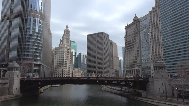 Chicago, Illinois, USA, March 28, 2024: View along the Chicago River towards the bascule Irv Kupcinet Bridge on Wabash Avenue with the Wrigley Building in the background.