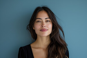 Fototapeta premium A close up portrait of a young woman with a subtle smile