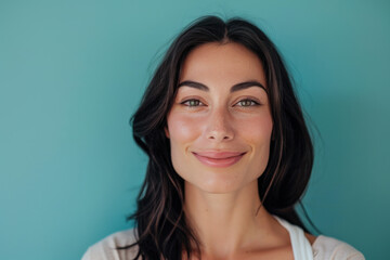 A close up portrait of a young woman with a subtle smile