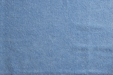 Soft blue towel as background, top view