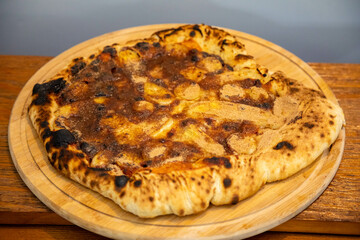 Traditional sweet Brazilian banana pizza with cinnamon, chocolate and catupiry