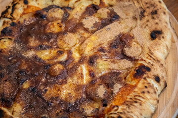 Traditional sweet Brazilian banana pizza with cinnamon, chocolate and catupiry
