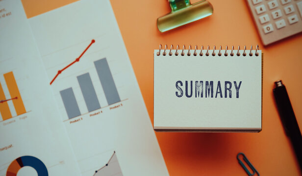 There is notebook with the word Summary. It is as an eye-catching image.
