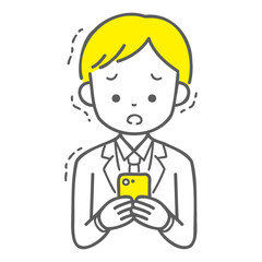 スマホを見て震えている男子学生