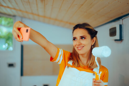 Woman Taking a Selfie with a Paint Roller Renovating her Home. Joyful repairwoman trying to remodel her house alone
- Powered by Adobe