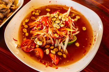 Som Tum - Thai Spicy green papaya salad with salty eggs - Asian food style