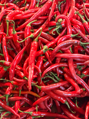 Red hot chilli peppers texture background, close up, A backdrop of Red hot chilli peppers, Street vegetable market, Group of Red hot chilli peppers