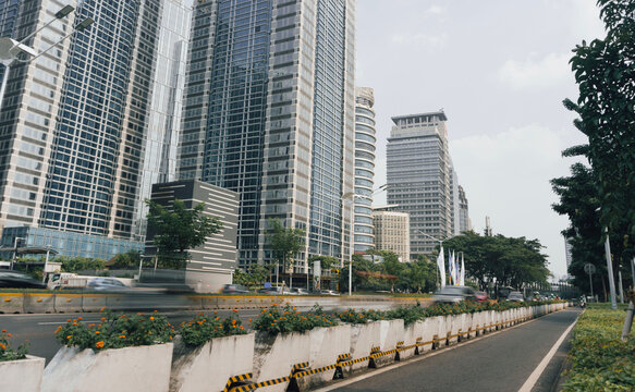 Road traffic at Sudirman street while vehicles passing by in motion. Jakarta- Indonesia.