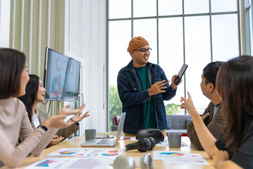 Happy diverse group Asian business start up freelance team analyzing statistics financial. Group Team of business people meeting conference discussion various topic corporate concept in office.