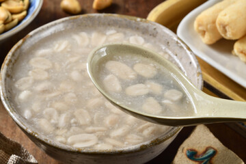 Sweet peanut soup on the wooden table  