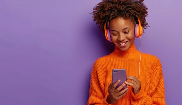 African american woman listening to music with headphones on cell phone while traveling by public transportation