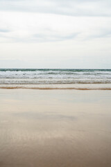Beautiful Soft blue ocean wave on fine sandy beach