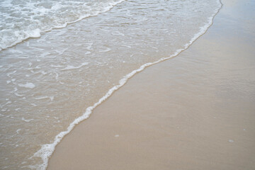 Beautiful Soft blue ocean wave on fine sandy beach