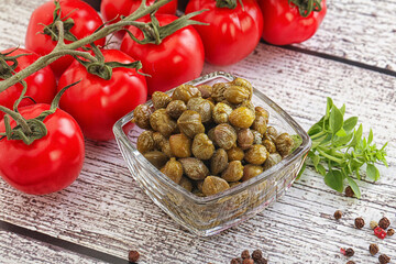 Marinated green capers in the bowl
