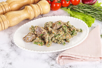 Fried turkey liver with herbs in cream sauce