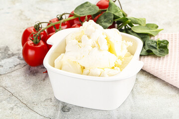Soft cream cheese in the bowl