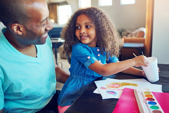 Black family, dad and girl with painting for homework in home for education, learning and support with care. Man, school work and happy parent teaching for child development, art and creativity