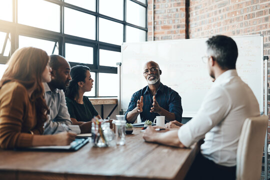 Mature, manager and business meeting in boardroom with discussion for financial growth at table. Company, vision and planning in workshop with mentor, staff and teamwork training in accounting firm.