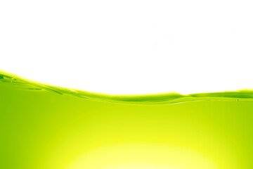 Abstract green oil liquid splash, green juice surface against white background.