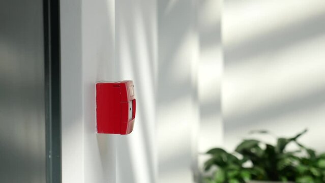 Red fire alarm button on wall ,