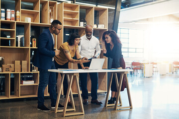 Team, meeting and work collaboration with laptop, web design and business people with discussion....