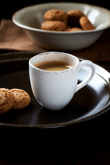 Cup of coffee on wooden background.