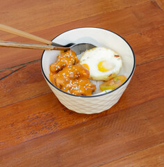 Rice Bowl Chicken Sauce Karage With Sunny Side Up Egg In The Table