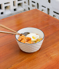Rice Bowl Chicken Sauce Karage With Sunny Side Up Egg In The Table