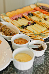 Meat, cheese, dips and appetizer display at event