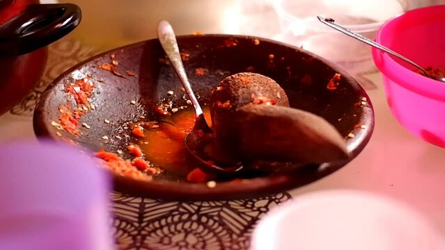 Traditional chili sauce in a mortar.