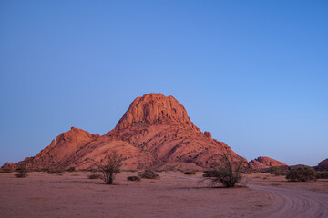 The Spitzkoppe  is a group of bald granite peaks or inselbergs located between Usakos and Swakopmund in Namib desert I Namibia, sunset photo