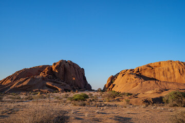 The Spitzkoppe  is a group of bald granite peaks or inselbergs located between Usakos and Swakopmund in Namib desert I Namibia, sunset photo