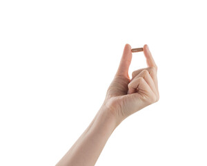 Female hand hold beige pill isolated on white