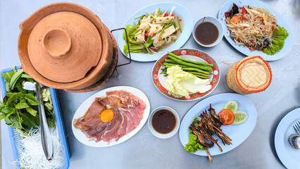 clay pot.Thai traditional spicy shabu shabu, dipping meat in boiled spicy soup.