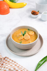 Indonesian Food Kolak made from banana and coconut cream, brown sugar, pandan leaves