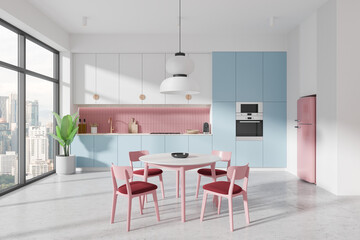 Modern kitchen interior with light blue and pink cabinets, a dining table, and pink chairs, city view through large windows, contemporary design.  3D Rendering