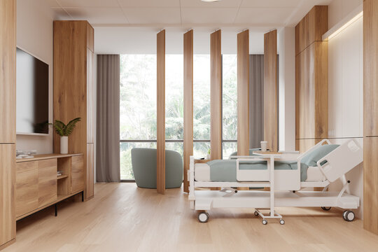 Modern hospital room interior with bed, tv and drawer. Panoramic window