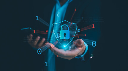 Businessman showing key and symbolic shield represents protection against cyber attacks and online hacking, Protection against external hacks, Cybersecurity and privacy concepts to protect data.
