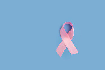 Breast cancer, ribbon symbol on blue background, medical hope awareness campaign