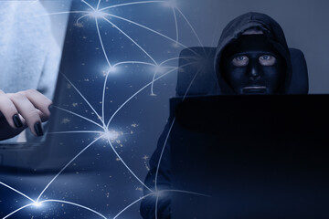 Hacker steals data via laptop, international phishing and bank account theft, cybercrime on the internet, security breach with malware, anonymous hacker in the dark web.
